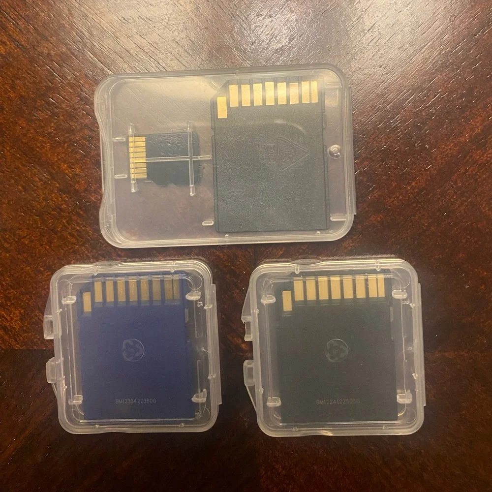 THREE SANDISK MEMORY CARDS 2 32G AND 1 16G WITH MICO ADAPTER BRAND NEW